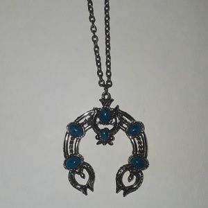 Horseshoe-shaped silver with blue stones necklace